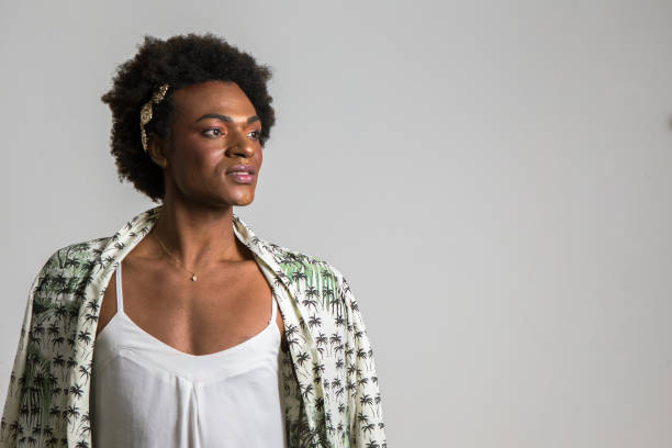 stylish black woman looks to the side in ad pose
